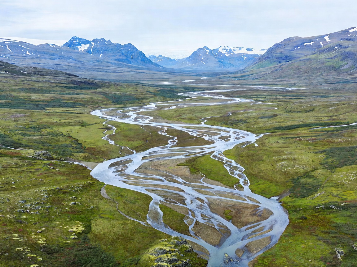 Vast Arctic tundra valley with winding braided rivers in Swedish Lapland